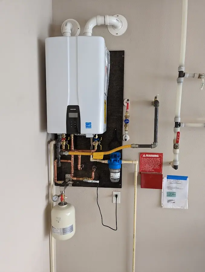 Professional plumber installing copper piping in a Karnes City home